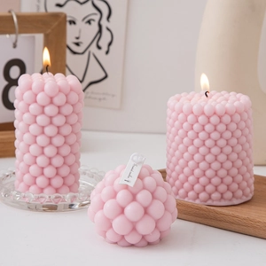 Pink bubble pillar scented candle set displayed on a wooden tray for home decor