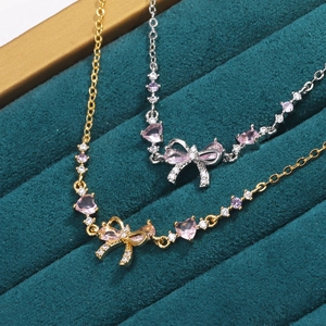 Bowknot and heart necklaces with sparkling zircons in gold and silver finish