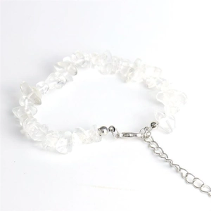 Detail of adjustable natural crystal stone bracelet with silver lobster clasp and chain
