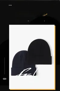 Detail of black and navy blue ribbed knit beanies with a thick folded cuff for winter warmth