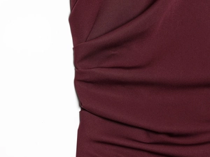 Close-up of wine red balloon dress showing the premium pleated fabric texture