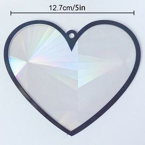 Detail view of 5-inch heart suncatcher with holographic pattern and black frame
