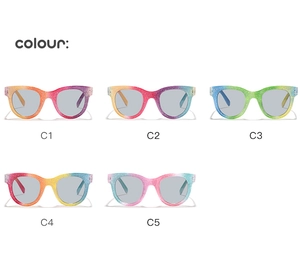Detail view of round glitter kids sunglasses with vibrant rainbow gradient frames in five colors