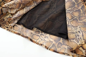Close-up of leopard print dress hem with double-layered fabric and fine stitching