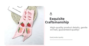 Detail of pink floral ribbon hair tie with strawberry prints and Japanese text