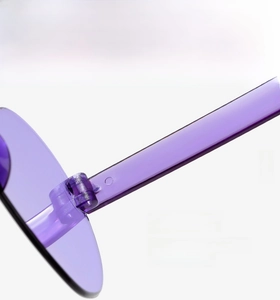 Detailed view of the durable purple transparent sunglasses hinge for smooth folding