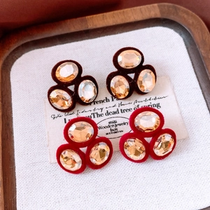 Detail view of oval crystal clusters with velvet base in rich brown and red tones