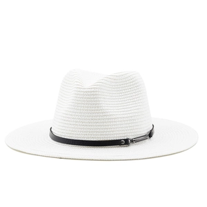 Close-up of white straw sun hat featuring a black leather band and metal buckle detail