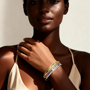 Elegant 18k gold and silver plated gourd clasp bangles with sparkling zircon on model wrist