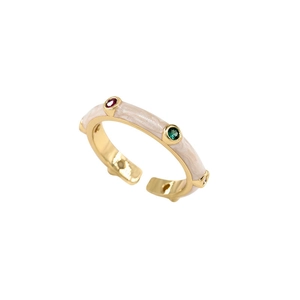 Vintage gold open ring with colorful gemstones and white inlay on a white background