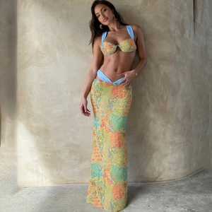 Three-piece bohemian set with orange floral crop top and high waist maxi skirt