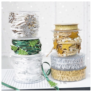Close-up of assorted Christmas ribbons with gold stars, pink bows and snowflake pearls