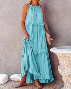 Close-up of sky blue tiered maxi dress showing ruffled layers and pleated fabric texture