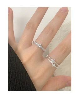 Close-up of S925 sterling silver double-layer star rings with zircons on a hand