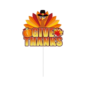 Close-up of Thanksgiving yard sign with cartoon turkey and 'GIVE THANKS' text