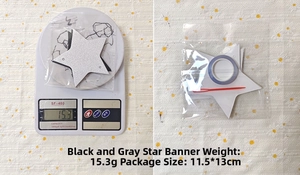 Detail view of black and gray star garland set weighing 15.3g and 11.5x13cm packaging