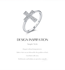 Detailed macro view showing the S925 hallmark on the silver cross ring with stones