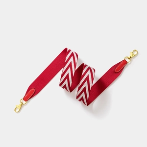 Red and white V-pattern canvas strap with red lychee leather and gold metal clips