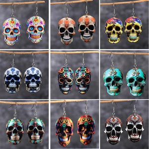 Detailed grid of nine Mexican sugar skull drop earrings with colorful artistic patterns