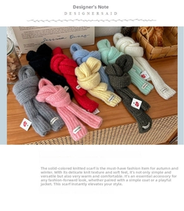 Detailed knit texture of colorful skinny scarves with vegetable woven labels on wood