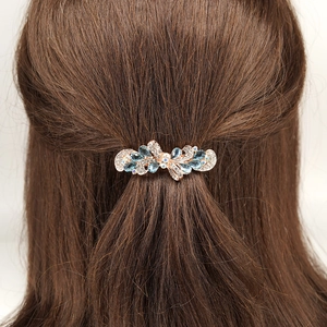 Barrette papillon élégante en cristal bleu et strass sur support en alliage or rose