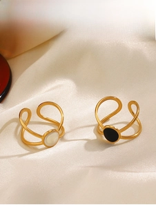 Detail of 18K gold plated oval enamel rings with cross lines and adjustable open band