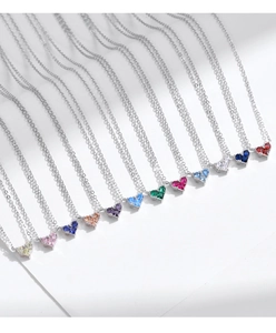 Collection of twelve heart-shaped colorful zircon pendants on sleek silver chains