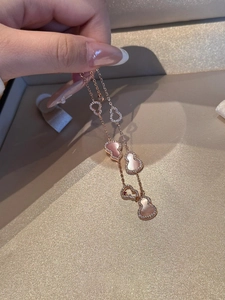 Detail of rose gold gourd bracelet featuring pink shell inlay and sparkling zircon pavé