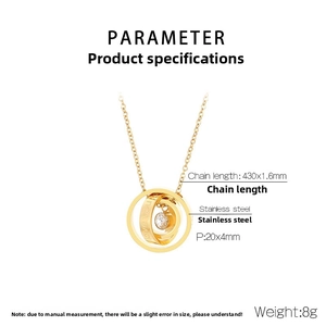Detail view of gold stainless steel necklace showing three-ring pendant with zircon inlay