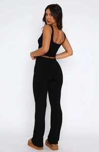Back view detail of black sleeveless bodysuit and matching long pants two-piece set