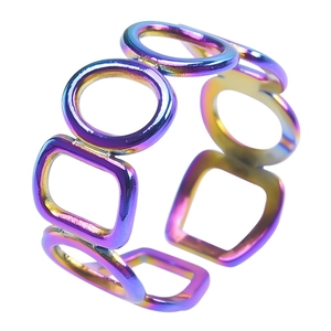 Macro detail of rainbow hollow geometric adjustable ring showing colorful metal texture