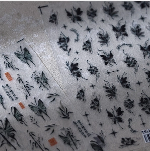 Detailed view of 5D ink butterfly nail decals with bamboo and calligraphy motifs