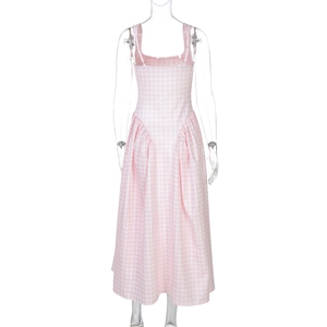 Detail view of pink and white checkered dress showing open back and cinched waistline