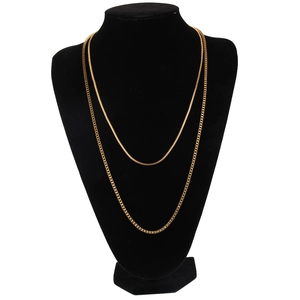 Close-up of golden dual-layered 2mm stainless steel box chain necklace on black mannequin