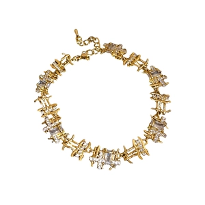 Elegant gold necklace with square zircon stones and lobster clasp on white backdrop