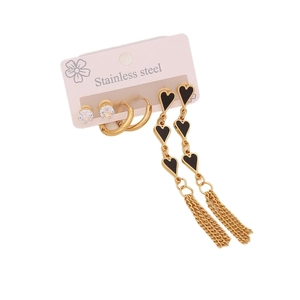 Stainless steel gold hoop earrings set with black heart tassels and zircon studs on white back