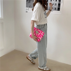 Pink leopard print canvas tote bag shown by a model for daily storage use