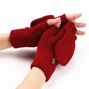 Detail of dark red knit convertible mittens showing textured fabric and fashion button