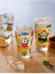 Close-up of glass cups with colorful panda prints and ice cubes on a wooden table