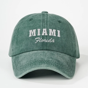 Vintage washed dark green baseball cap with white Miami Florida embroidery on front
