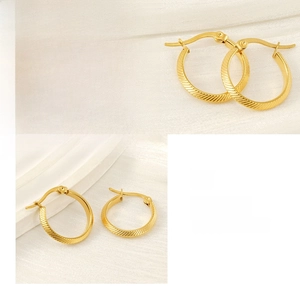 Detail showing diagonal stripes on 18K gold-plated stainless steel hoop earrings