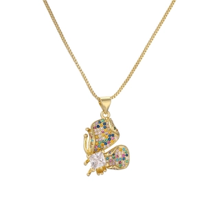 Elegant gold butterfly pendant necklace with colorful zircons on a white background