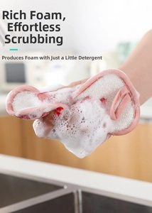 Pink sparkling dishwashing sponge with rich soapy foam for kitchen surface cleaning