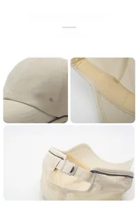 Détail du tissu en maille respirant et boucle métallique réglable sur casquette beige