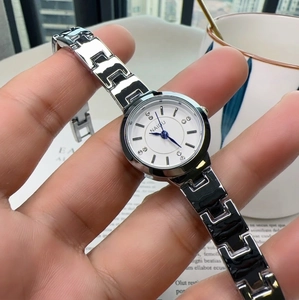 Silver chain style quartz watch for women featuring a white dial with crystal accents