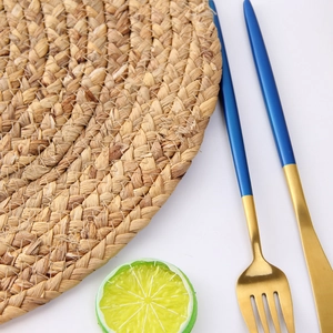 Close-up detail of hand-woven water hyacinth heat-resistant coaster with tight spiral texture