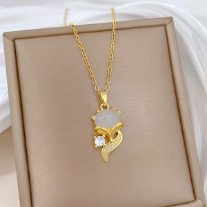 Luxurious gold titanium steel necklace with a cat-eye fox pendant and sparkling zircons