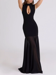 Detail of elegant black bodycon dress featuring keyhole cutout and sheer fishtail hemline