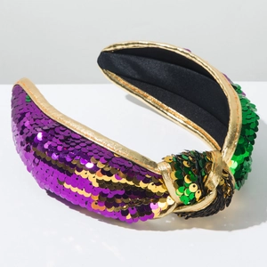Détail d'un serre-tête noué Mardi Gras avec paillettes violettes, dorées et vertes