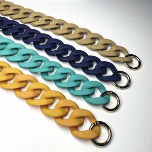 Colorful acrylic handbag chains with gold metal clasps in beige, blue, teal, and yellow
